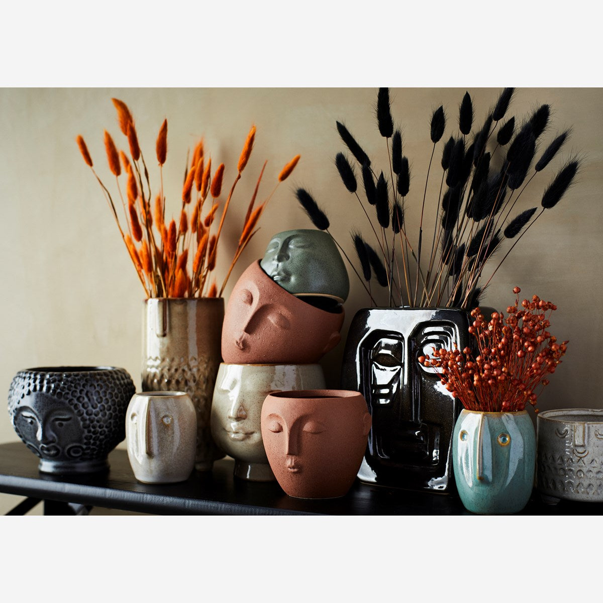 Stoneware flowerpot with a face